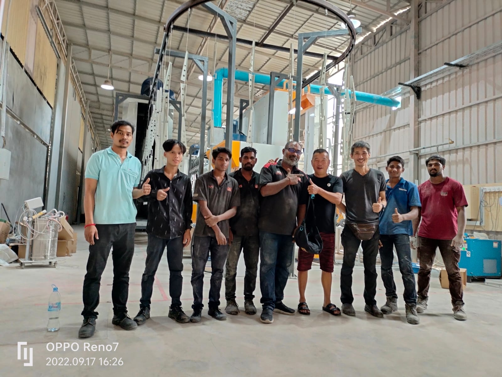 Project team inside a machinery installation facility in Cambodia